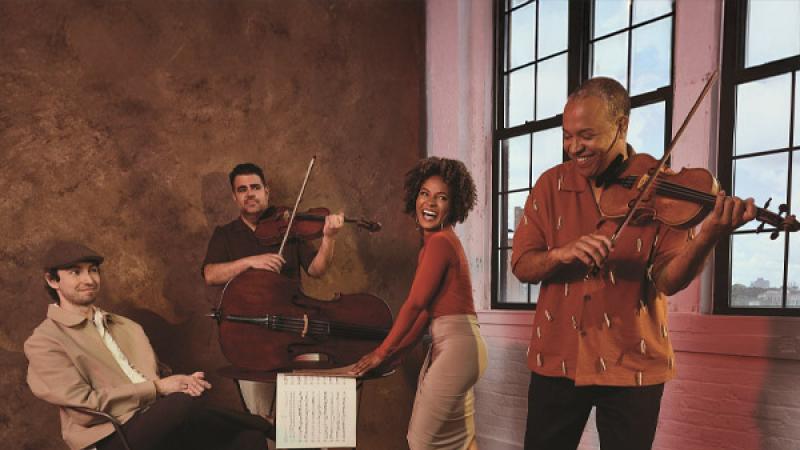 Harlem Quartet playing instruments