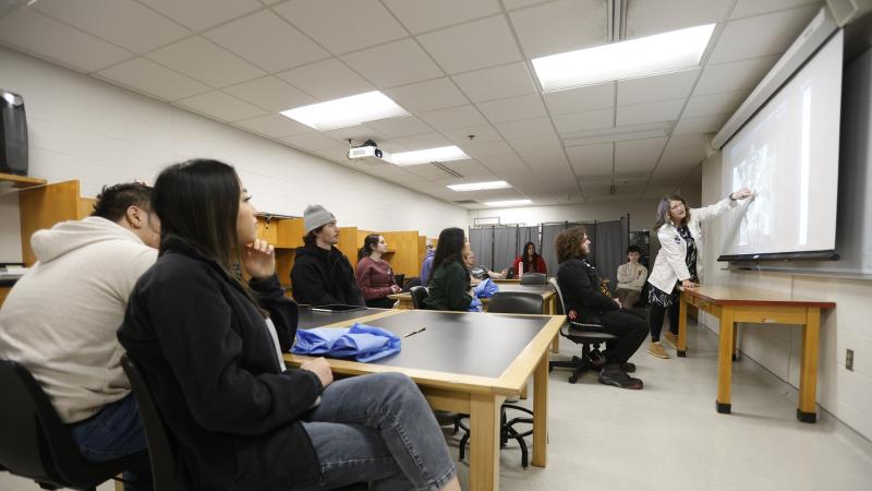 Elizabeth Becker leads a lab class that has Appleton East High School students joining her students. (Photo by Danny Damiani)