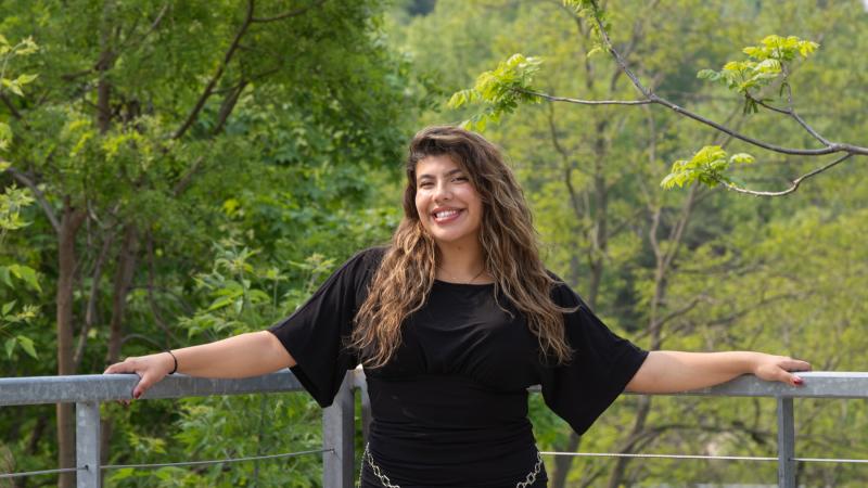 Bruna Velez is all smiles as she poses for a photo on campus.