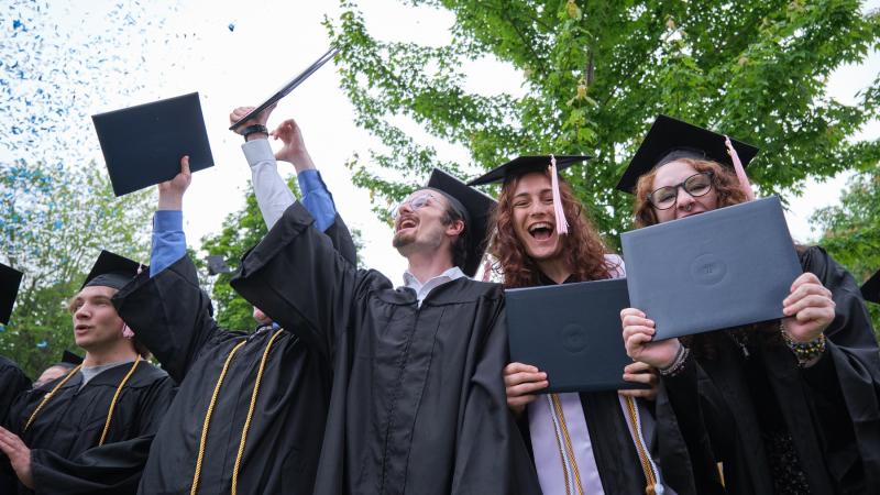 Confetti flies as Lawrence graduates cheer at the close of Commencement.