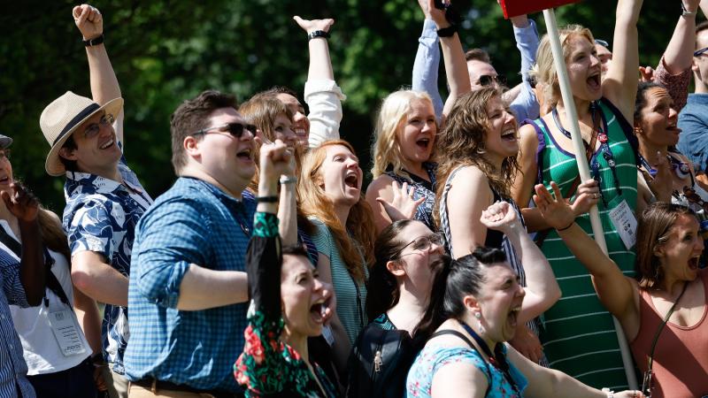 Graduates cheer for photo during Reunion 2024