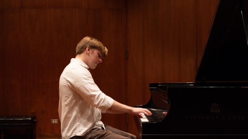 William Surtees plays the piano.
