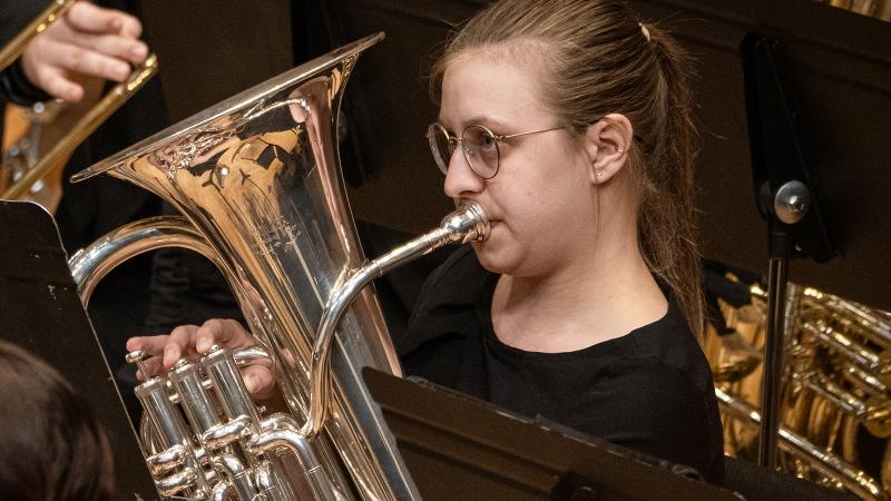 A musician playing the euphonium in Wind Ensemble.