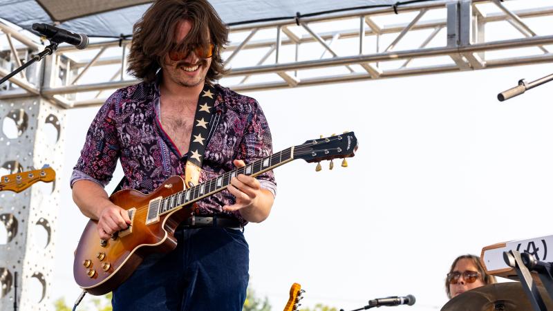 Michael Murphy plays his guitar at Mile of Music.