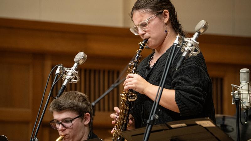 A musician playing soprano saxophone.