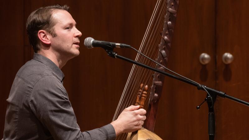 A musician talking about the multi-stringed kora instrument.