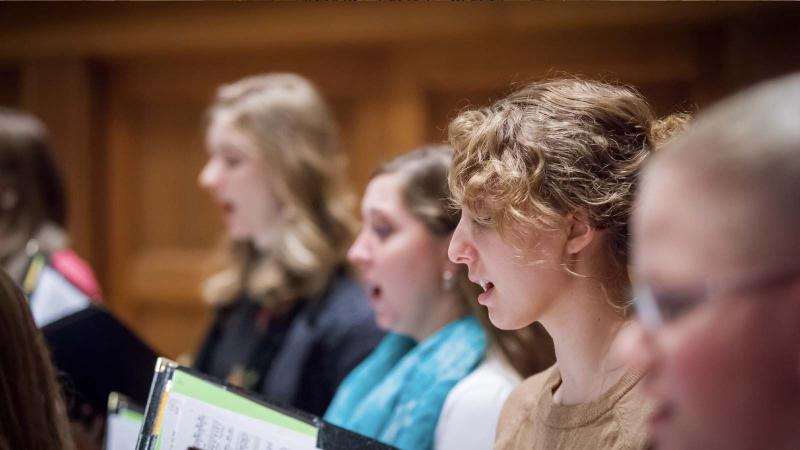 Women's choir performing in Lawrence Memorial Chapel