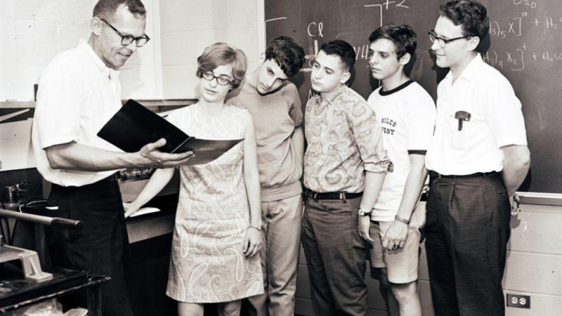 Professor Allen West on left instructs students in a classroom