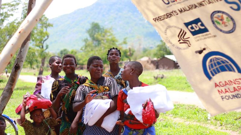 Women and children receive anti-malarial bednets as part of a public health program in Kalinde and Nambazo, Phalombe Nambazo North, Malawi, in Dec 2010