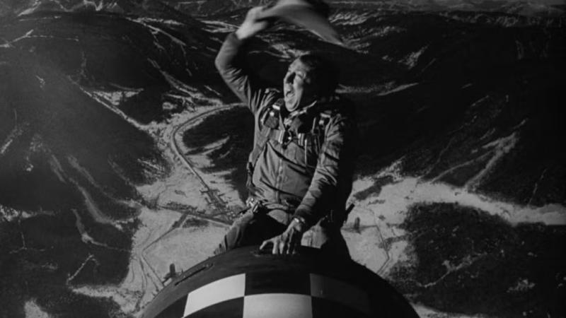 Dr. Strangelove film still: Man riding a missile like a cowboy.