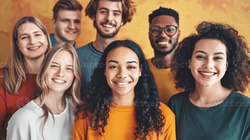 A diverse group of individuals, smiling