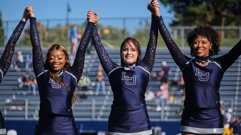 Students perform dance routine at halftime