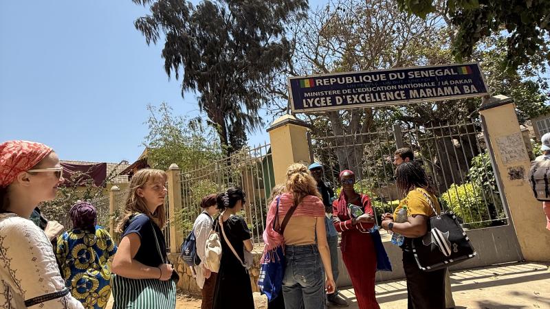 Students outside of the prestigious girls high school Mariama Bâ on Gorée Island on a beautiful sunny day. (2025)