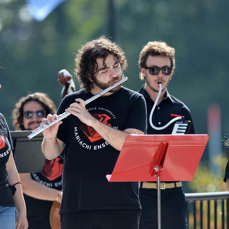 Mariachi Ensemble plays outside the Banta Bowl during the President's Tailgate