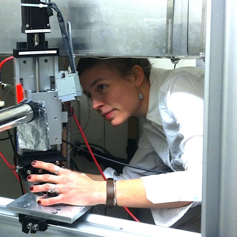 photograph of Professor Margaret Koker setting up x-ray equipment for an experiment