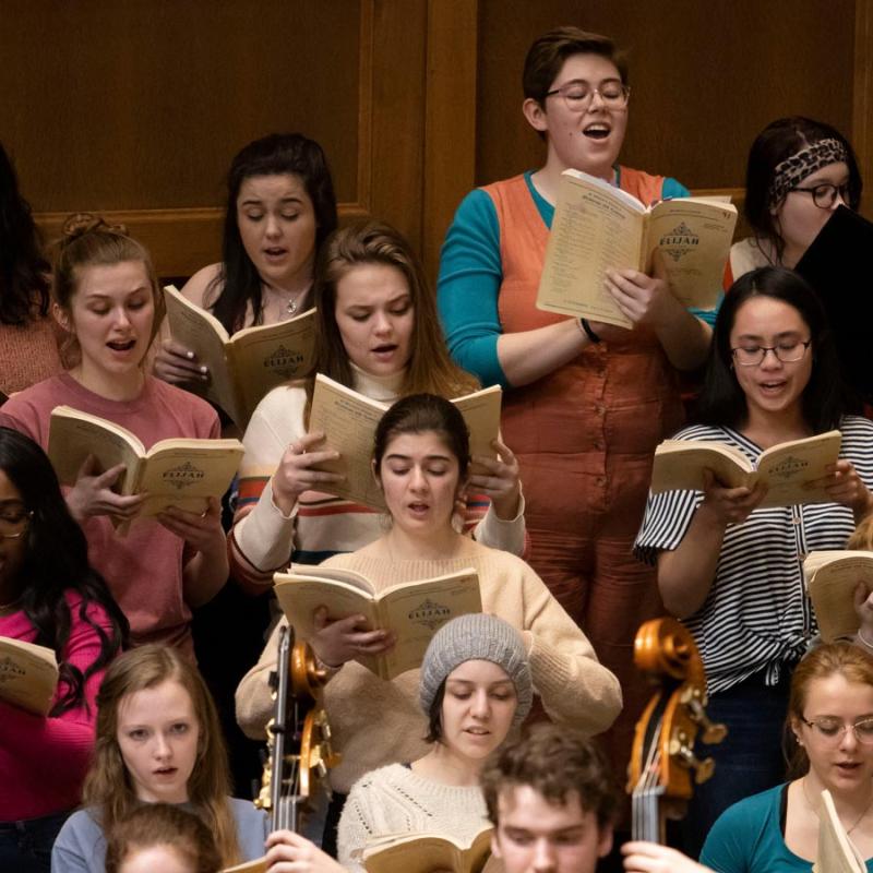 Students singing on stage