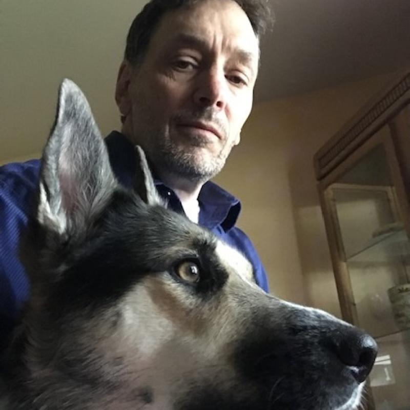 Ed Berthiaume poses with his dog, Hunny