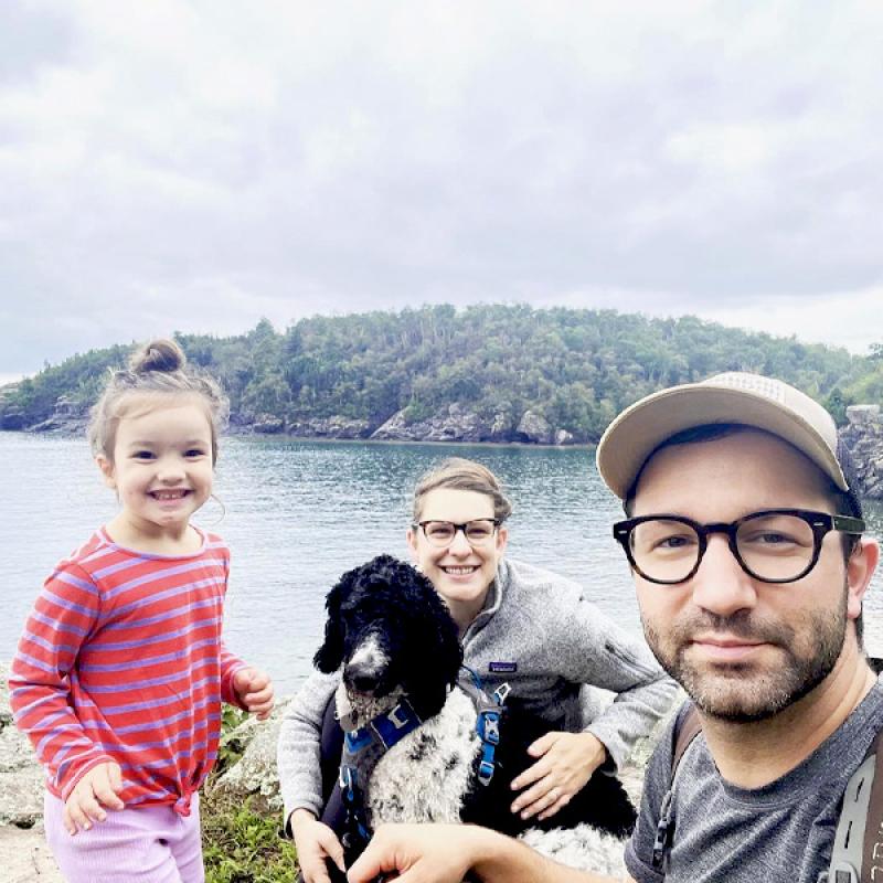 Liz Anderson profile pic with dog husband and daughter