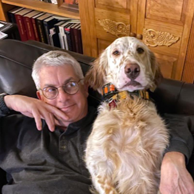 Michael Stein ‘80 fun profile with his dog in his library