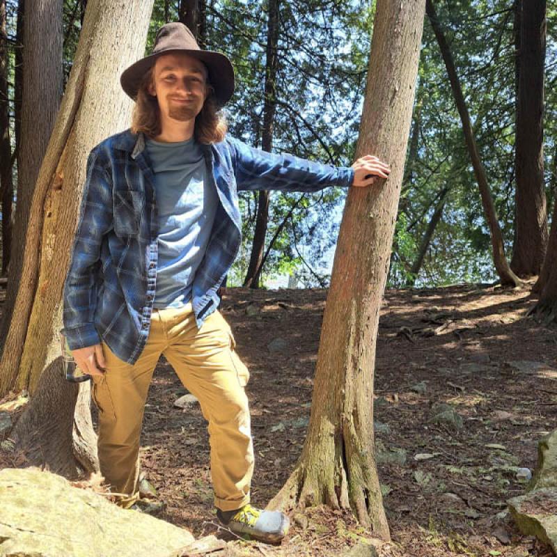 Matthew J. DeChant standing in woods profile