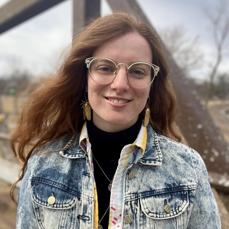 Image of Kellyn outside, smiling, and informal headshot.