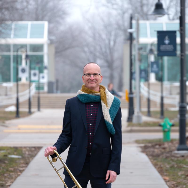 Picture of Tim Albright holding a trombone