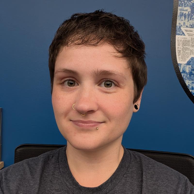 Image of Melissa in front of a blue background