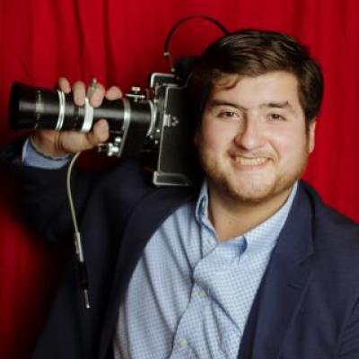 Juan Marin holding a retro film camera