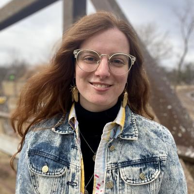 Image of Kellyn outside, smiling, and informal headshot.