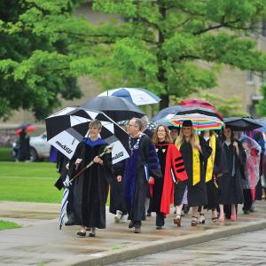 Faculty processional outdoors heading to greet the soon-to-be Class of 2019 graduates.