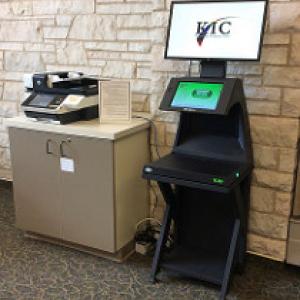 KIC overhead scanner next to a standard bed scanner.