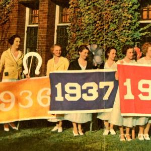 Milwaukee-Downer classes of 1935-1938 holding their class color banners