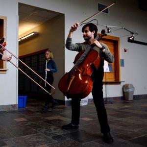 Cellist and trombone performers in Warch Campus Center