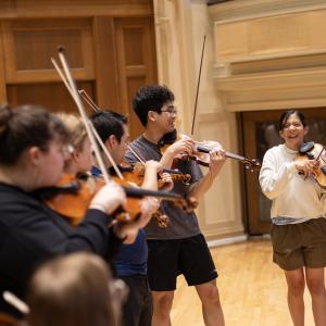 LSMI Students rehearsing on Memorial Chapel stage