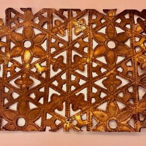 A metal stencil used by artisans in the Ahmedabad Wood Carving Company