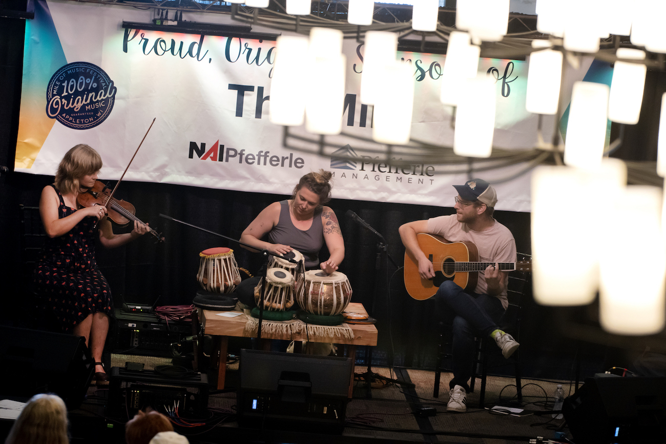 Lawrence experience, connections drive acoustic trio Sprig of That