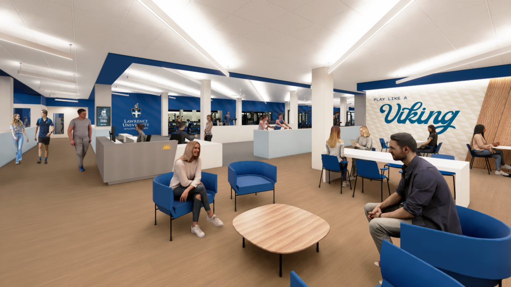People sit and talk in a modern university lounge area with blue seating, wood flooring, and Play Like a Viking on the wall. Other people walk and work at desks in the background.